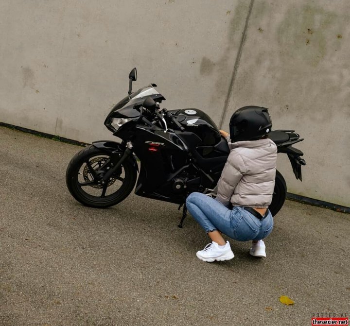 25 hot babetight jeans posing motorcycle stwj28 720x671