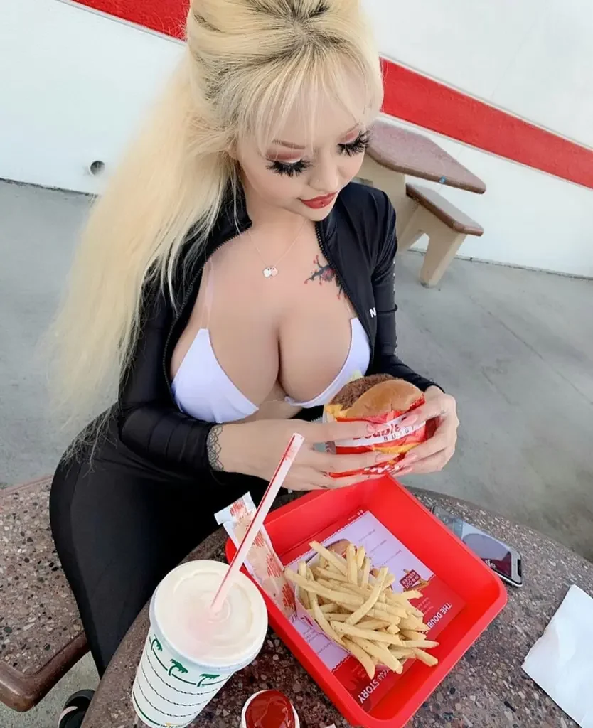 27 hot busty asian chick eating hamburger yncfp27